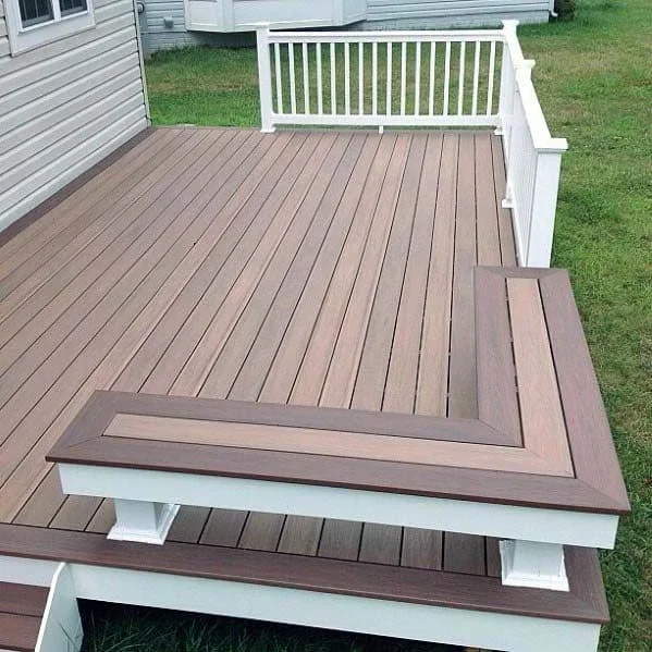 Multi-tiered composite deck with white railing and linear board pattern